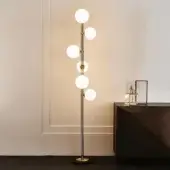 Exquisite Cattelan Italia Planeta floor lamp with burnished steel and brushed brass accents emitting warm satin white glass illumination