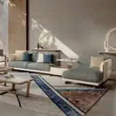 Sophisticated Turri Vine sectional with external leather shell and textured gray fabric cushions, built with brushed gold metal accents