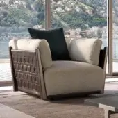 Elegant Turri Net lounge chair in light beige textile with woven brown leather paneling and Eucalyptus wood frame