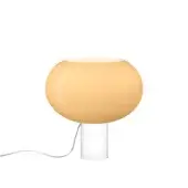 Foscarini Buds table lamp, warm yellow acrylic, features a rounded translucent shade, curved stem, and clear cylindrical base.
