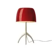 Foscarini Lumiere Grande table lamp, cherry champagne, features a conical red shade, silver stem, and tripod base.