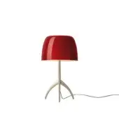 Foscarini Lumiere Piccola table lamp, cherry champagne, glossy red rounded shade with silver stem and three curved metallic legs.