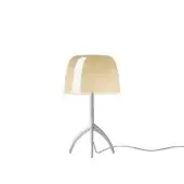 Foscarini Lumiere table lamp, warm white aluminum, rounded beige shade with curved opening and silver tripod base.