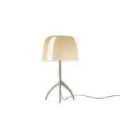 Foscarini Lumiere Piccola table lamp, champagne translucent shade, brushed metal tripod base, minimalist modern design, white background.