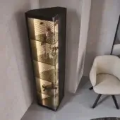 Elegant Cattelan Italia Atelier showcase with triangular form, smoked glass shelves and diamond-quilted leather backdrop illuminated by integrated lighting