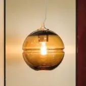 Distinguished Turri Madison suspension lamp with amber-gradient glass globe and bronze-colored metal fittings
