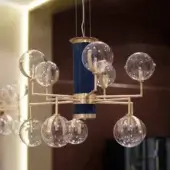 Distinguished Turri Madison lamp with ten illuminated transparent glass spheres and a dark blue grooved column in satin metal finish