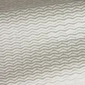 Chevron fabric sample in sand mixture tones displays a woven texture with subtle sheen and repeating V-shaped pattern throughout the frame.