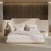 Exceptional Turri Roma bed with pale beige upholstery, curved headboard and subtly textured side panels crafted in Italy