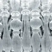 Transparent glass crowns collection, rippled texture, silver background, repeating grid pattern, rounded bases, fluted shafts.