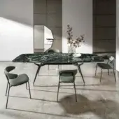 Distinctive Sovet Italia Arkos shaped extendable table with green marbled ceramic top and lacquered black aluminum frame built with gold accents