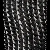 Geometric dark crystal texture with repeating triangular facets in a grid pattern, glossy finish, and high contrast highlights on black.