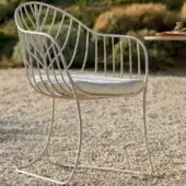 Distinctive Royal Botania Folia armchair with curved metal structure and matte finish captures attention through minimalist design