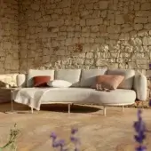 Exceptional Royal Botania Organix lounge sofa with light gray textured upholstery and reddish-brown accent pillows