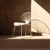 Superior Royal Botania Ostrea lounge chair crafted in coated stainless steel with a smooth white finish and textile cushion