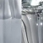 Etched glass surface with flowing water, displaying transparent textures and reflective distortions under studio lighting.