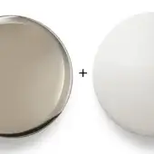 Nickel disc and matte white sphere on white background, labeled with color names, showcasing brushed metal texture and smooth surface.