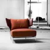 Distinctive Erba Abbraccio lounge chair with vibrant orange cotton upholstery and reddish-brown wings, built with a bright chrome steel frame