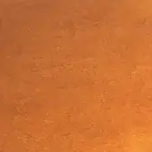 Amber textured surface with uneven tone and depth, displaying warm orange and brown hues under soft, diffused lighting.