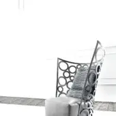 Sophisticated Erba Icona lounge chair with steel frame, refined cotton upholstery in medium gray, and epoxy varnish finish