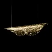 Amber fused glass pendant light, organic curved shape, textured surface, internal illumination, black background studio shot.