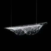 Fused glass sculpture, curved form, transparent with red-gray hues, textured rippled surface, suspended by wires against black background.