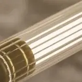 Cylindrical pendant light, ribbed glass and brushed brass, with vertical ridges and horizontal metal bands encircling a clear outer housing.