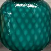 Verde pavone glass vase, diamond-textured surface, bulbous shape, glossy finish, reflective highlights, neutral gray background.