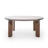 Kenobi table, gray-beige stone top, walnut legs with metal accents, minimalist design, studio product shot, even lighting.
