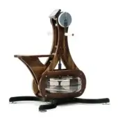 Walnut rowing machine with dark wood frame, circular flywheel, sculpted seat, gray platform, and “NOHR” plaque against white backdrop.