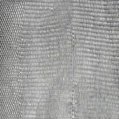 Metallic fishnet texture with a repeating linear grid pattern in silver tones, exhibiting a dense and subtly reflective surface.