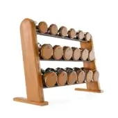 Three-tier dumbbell rack with cherry-colored dumbbells and silver handles, crafted from light wood with a rounded decorative top.