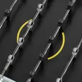 Foosball table rods with chrome finish, black grips, and white joints displayed diagonally across a black playing surface with yellow arc markings.