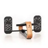 NOHRD Spinestretch exercise machine, light wood frame, black foot platforms with circular perforations, digital display, minimalist design.