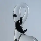Glass flamingo sculpture, clear with black accents, features a curved neck and rounded body against a gray gradient backdrop.