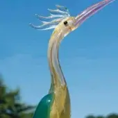 Glass bird sculpture, turquoise and pink, with gold accents, long slender neck, iridescent finish, clear glass feather crest.