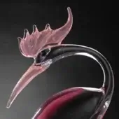 Glass bird sculpture, translucent pink & transparent, featuring curved neck, pointed beak, layered crest, and marbled burgundy body.