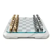Chess set, white marble frame, gold and acrylic pieces, checkered board, crystal accents, illuminated blue border, Teckell branding.