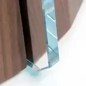Walnut cabinet detail, tempered glass insert, vertical channel, curved panels, polished wood, reflective prism, bright white background.