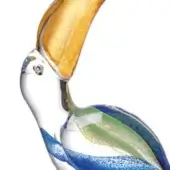 Glass toucan sculpture, clear with blue, green, and gold enamel, featuring a curved gold beak and textured, striped body.