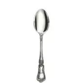 Silver spoon with polished oval bowl and ornate handle featuring scrolling floral patterns, against a white backdrop.