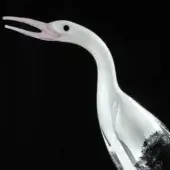 Glass stork sculpture, clear and pink, with curved neck and textured gray base, titled “black & pink – stork royal”.