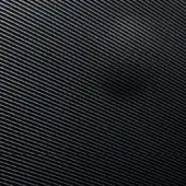 Guilloché texture displaying dark gray parallel lines angled diagonally, with subtle sheen and machined surface reflectivity in a studio setting.