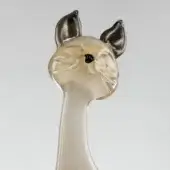 Glass cat sculpture, cream and dark gray, stylized Siamese with slender neck and smooth rounded face, glossy finish.