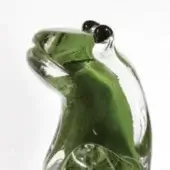 Glass frog sculpture, transparent with green accents, stylized form, glossy finish, minimalist design, white background.