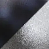 Textural contrast of brushed dark metal and rippled silver metal, diagonally split with a sharp transition and diffused lighting.