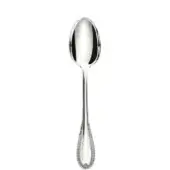 Silver spoon with elongated oval bowl and slender handle, featuring repeating floral motifs and a polished reflective surface.