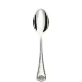 Silver spoon with elongated oval bowl, slender tapering handle, and embossed shell pattern at base, polished reflective surface.