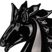 Black horse head sculpture, glossy resin, stylized form with flared nostrils and curved mane against a white backdrop.