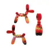 Red balloon dog sculptures by Juliarte with graffiti artwork in yellow, orange, blue, and green against a white backdrop.